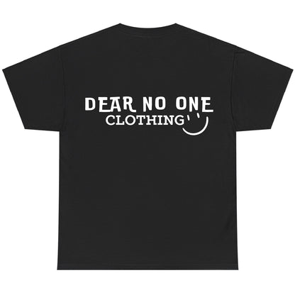 the back of a black 100% cotton Dear No One Clothing shirt displaying the Dear No One Clothing logo with a smile in white.